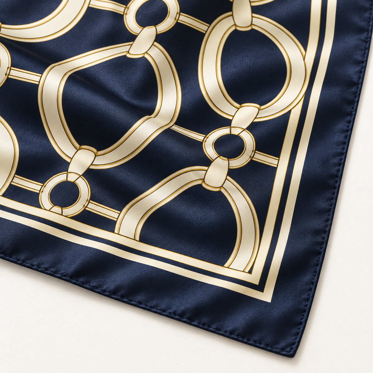 Close-up of printed chain motif and stitched flat hem