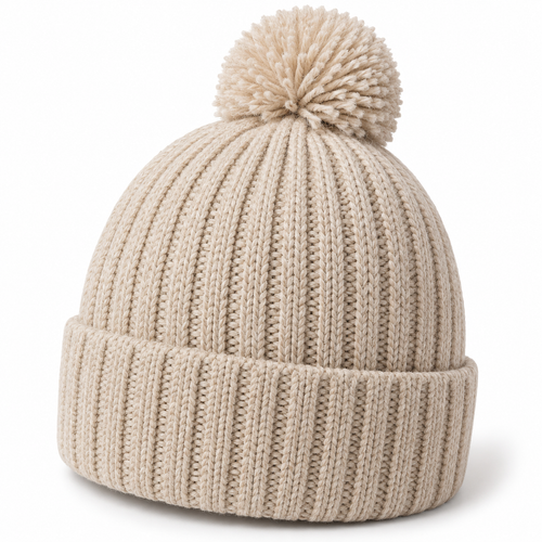 Oatmeal rib-knit beanie with folded cuff and matching yarn pom on white background