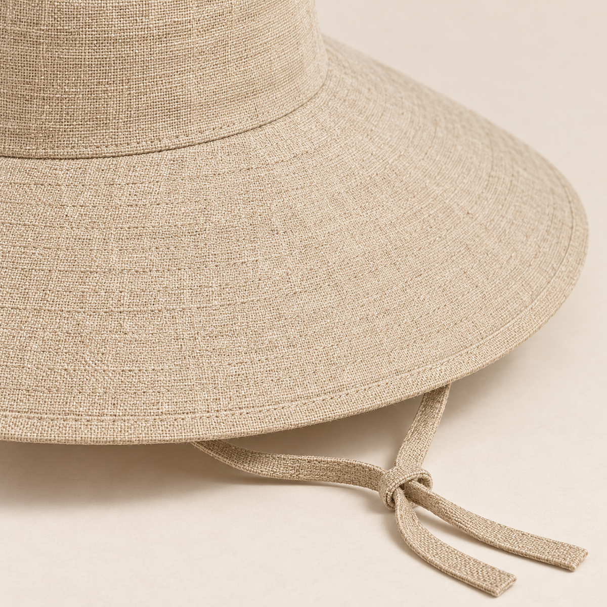 Sand Wide-Brim Tie Sun Hat — construction close-up (AI-generated design visualization)